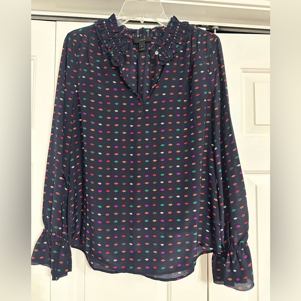 Women’s J. Crew 100% silk top blue with multi colored lips. Ruffle v-neck